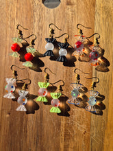 Load image into Gallery viewer, Glass polka dot twist wrap candy earrings.
