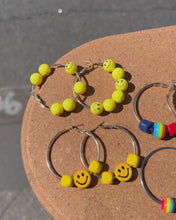 Load and play video in Gallery viewer, Rainbow Yellow Smiley Face Hoop Earrings
