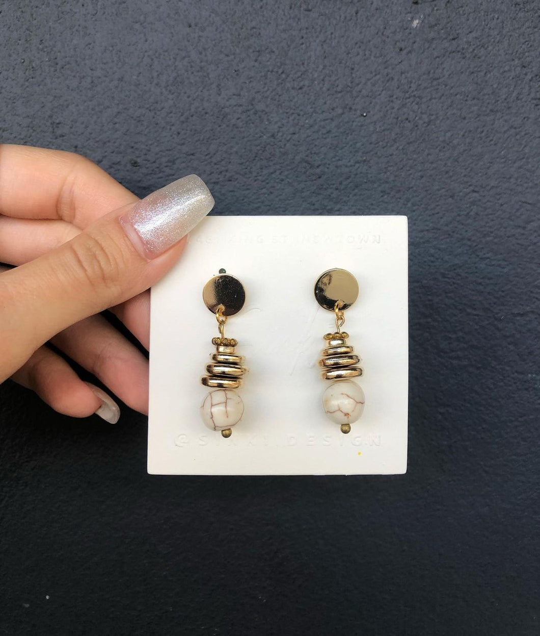 Gold beads earrings with stone