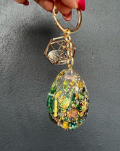 Load image into Gallery viewer, Drop-shaped Gold/Green Notes Hand Made Resin Key Chains
